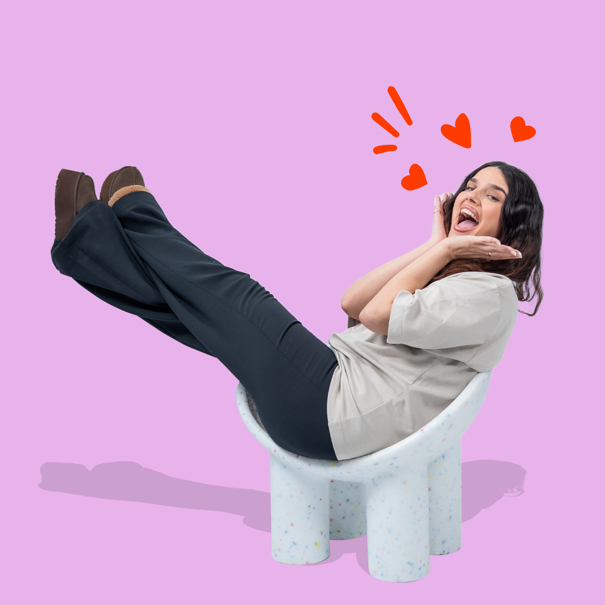 Person sitting on a white chair with 'Jelly Bean' logo above on a pink background